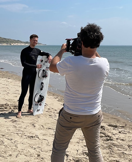 Person taking picture of surfer