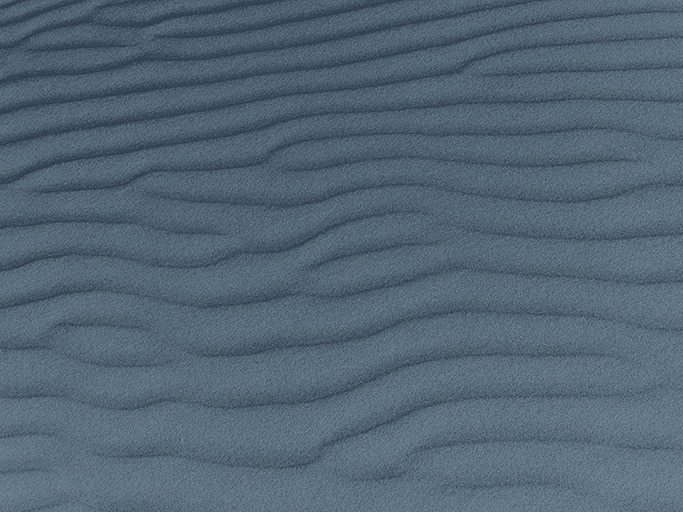 Sand texture.Dented wave of the blow of the wind